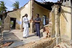 Rev.Jayasin Peiris, General Secretary of the National Christian Council of Sri Lanka, Inspects damages done in Point Pedro, a village on the east coast of Sri Lanka.  PAUL JEFFREY/ACT INTERNATIONAL