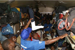 SALAMA—HIV/AIDS awareness program. Resource people(in blue) sharing information on a train. ZAIDA BASTOS-PWRDF