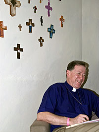 Archbishop Hiltz, pictured in the office of the Rev. Reinerio Arce Valentin, head of the Matanzas seminary, who collects crosses. VIANNEY (SAM) CARRIERE