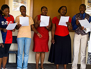 Staff from the John Wesley Community Centre in Etwatwa, South Africa, sing "Amazing Grace." ALI SYMONS