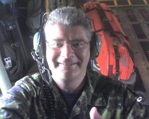 Padre Mintz in the spotter seat in the Herc