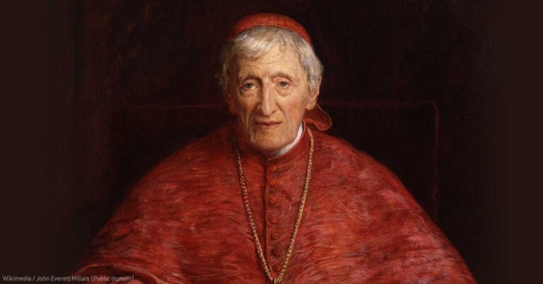 Portrait of a cardinal wearing a red robe and a gold chain, with a thoughtful expression, set against a dark background.