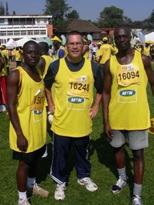 The Rev. Canon Paul Jeffries (centre) stands with two of his students after a 10 km run in Kampala, Uganda. BISHOP MCALLISTER COLLEGE, KYOGYERA