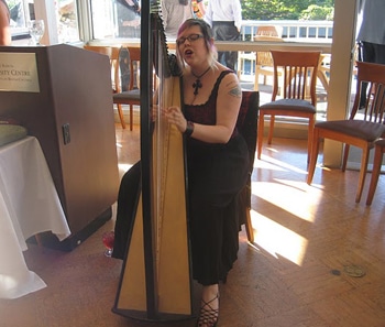 Harpist Clare Morgan plays at the National Worship Conference banquet on the University of British Columbia campus.