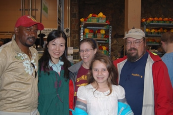 Wayne Vassell (Jamaica) and Shari Kung (Hong Kong) visit St. Lawrence Market with their Toronto hosts: the Rev. Heather McCance, Dave Robinson, and daughter Cara.