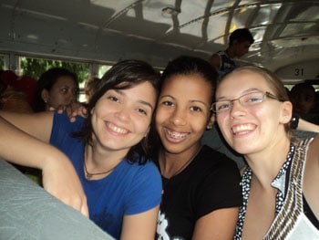 Rebecca McLeod (right) enjoys the best bus ride of her life with new friends Aleanis (left) and Claudia (centre). REBECCA MCLEOD