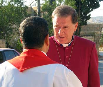The Primate, Archbishop Fred Hiltz, greets a leader of St. Matthew's Church, Zababdeh, during a 2009 visit to the West Bank. DR. ANDREA MANN