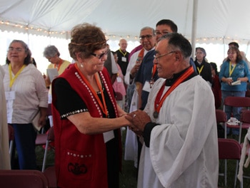 Sacred Circle members from British Columbia and the Arctic greet one another during the opening Eucharist.