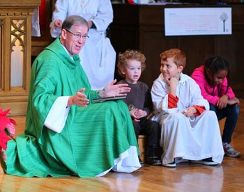 Archbishop Hiltz leads children’s story time at St. John’s Anglican Church, West Toronto. 