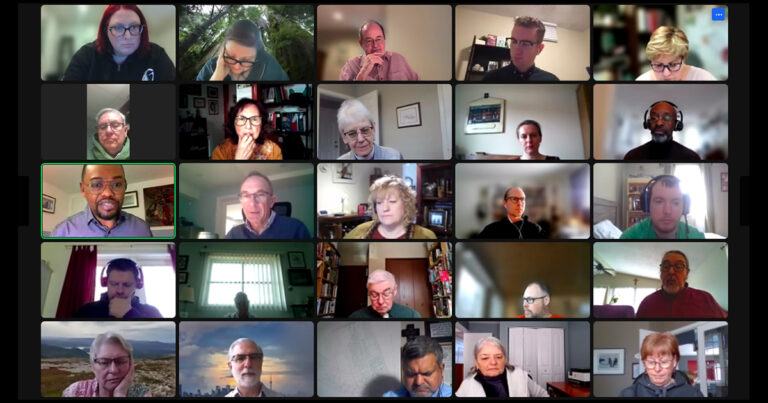 Collage of participants in a virtual meeting, with diverse individuals engaged in discussion and various expressions, set in a grid layout with different backgrounds visible in each frame.