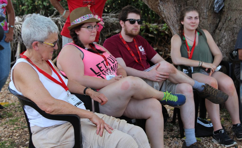 Left to right: Justice Camp participants Sue Moxley, Devon Goldie, Matt Gardner, and Evie Creary listen to members of Iglesia Santa Maria Virgen discuss the church's organic farm.