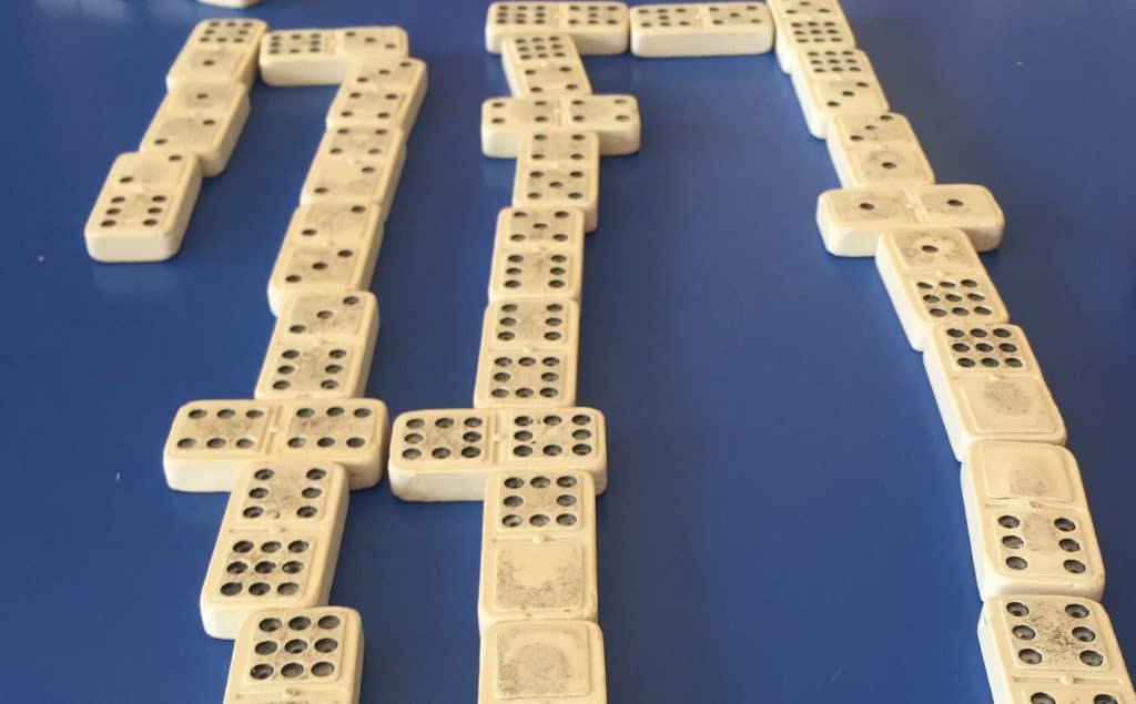 Playing dominoes.