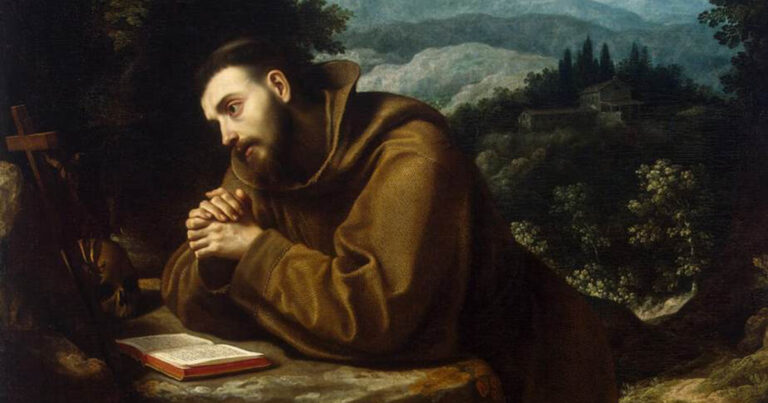 A contemplative figure in a brown robe sits at a table with hands clasped in prayer, surrounded by a serene landscape of mountains and trees in the background.