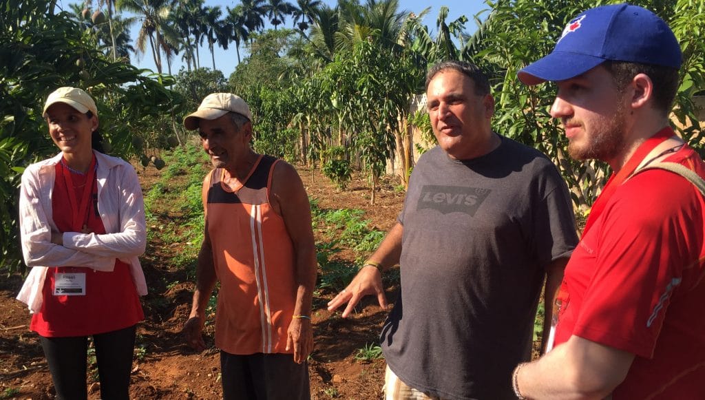 Left to right: Cuban planning team member Rosali Hardy Ramírez, local church member Enriqué, the Rev. Gerardo Logilves, and Justice Camp participant Andrew Kuhl tour the organic farm at Iglesia Santa Maria Virgen.