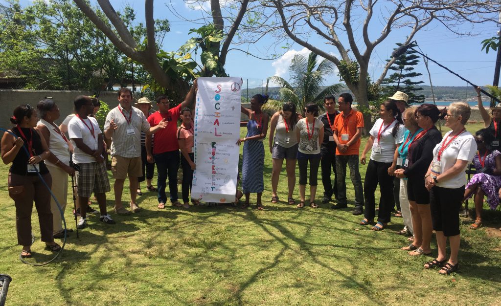 Members of the social engagement immersion group give a report to fellow Justice Camp participants.