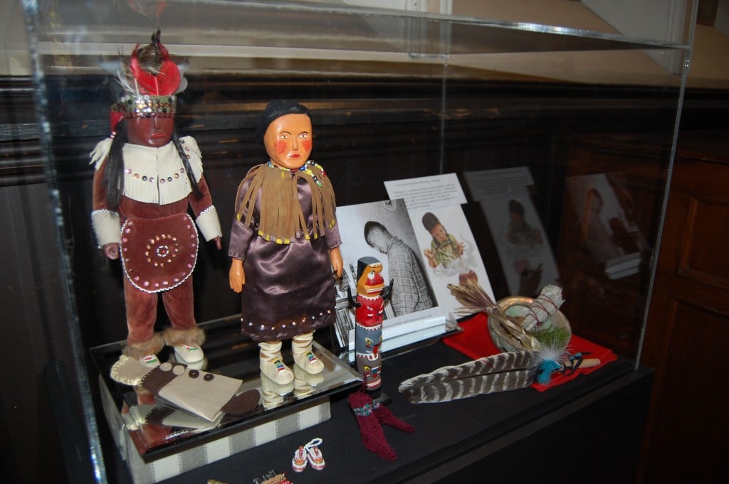 A display case from the Truth and Reconciliation exhibit features items saved from a classroom library and interest centre at a residential school, along with materials for performing a smudging ceremony as part of the Sacred Smoke Bowl Blessing. Photo by Matt Gardner