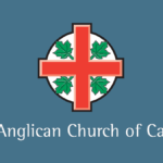 Banner with the emblem of the Anglican Church of Canada—a red cross with four green maple leaves—above the words ‘The Anglican Church of Canada’ on a dark blue background.