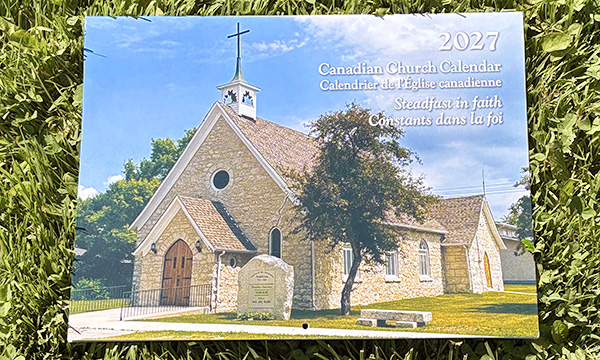 A copy of the 2027 Canadian Church Calendar laid on a background of grass