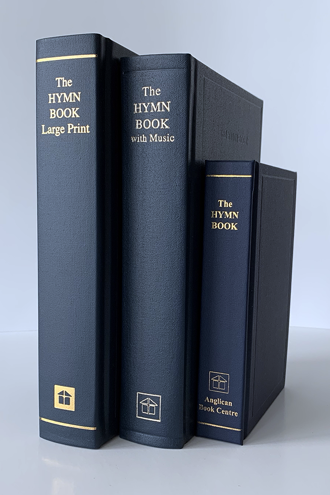 Three books stacked next to one another, each version of the Book of Common Praise (1938), including Large Print, Music and Words and Pew editions.