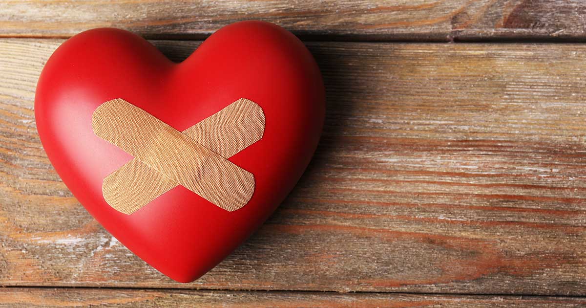 Image of a heart with bandages on a table 