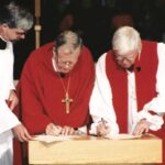 ELCIC National Bishop Telmor Sartison and Primate Michael Peers sign the Waterloo Declaration in July 2001